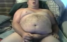 Obese bear stroking his dick